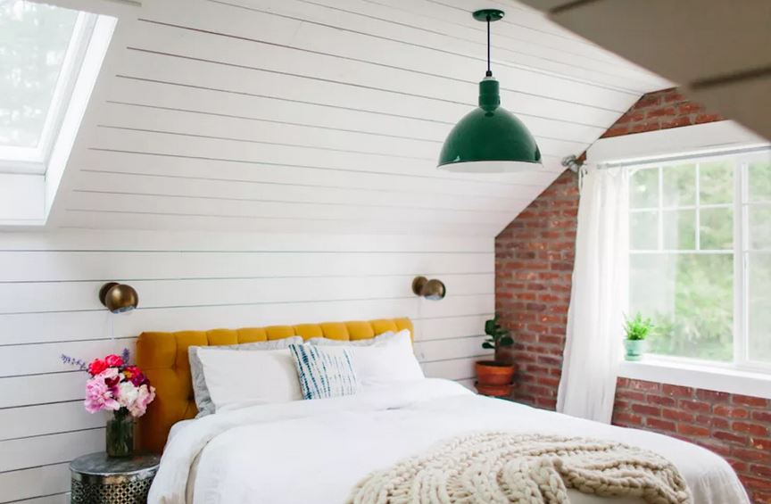 Attic bedroom with exposed bricks