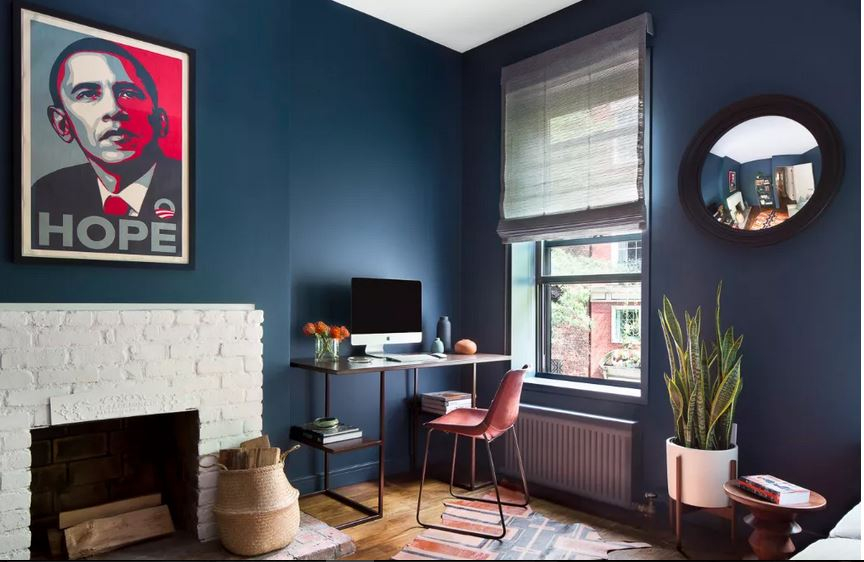 Bedroom with exposed bricks fireplace