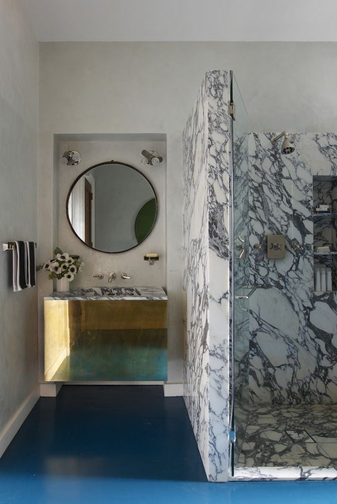 Dark and marble tile bathroom