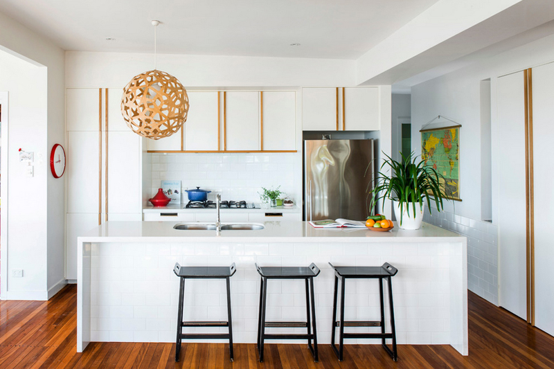 Kitchen with a wooden pendant light