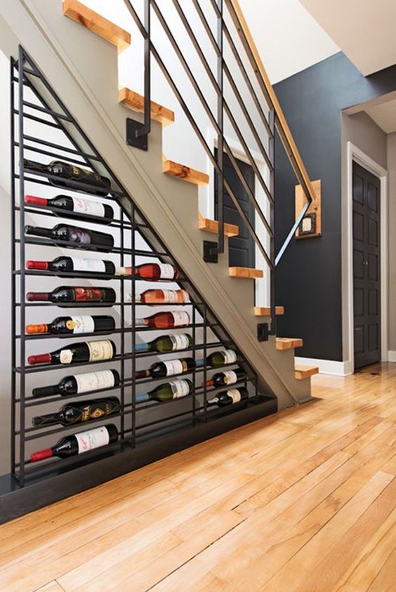 A-large-metal-wine-shelf-under-the-stairs-is-a-cool-idea-to-rock-in-any-living-room-your-little-wine-nook-is-here