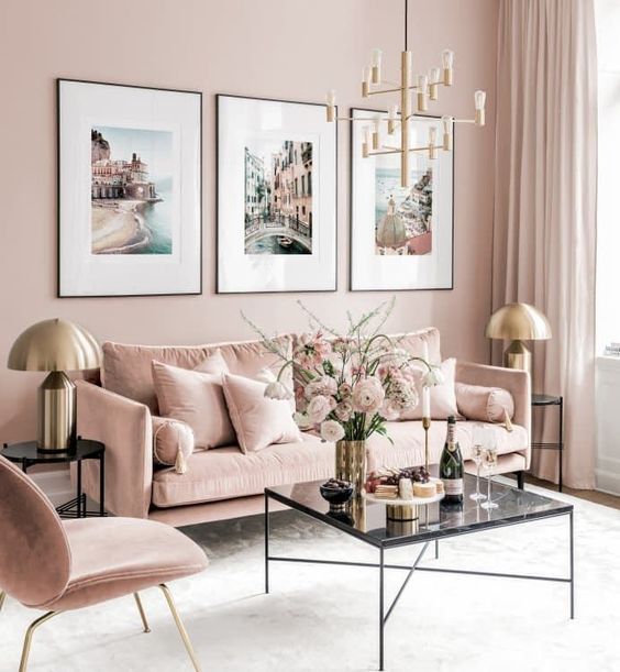 A-refined-living-room-with-blush-walls-blush-furniture-a-chic-gallery-wall-and-touches-of-gold-for-glam