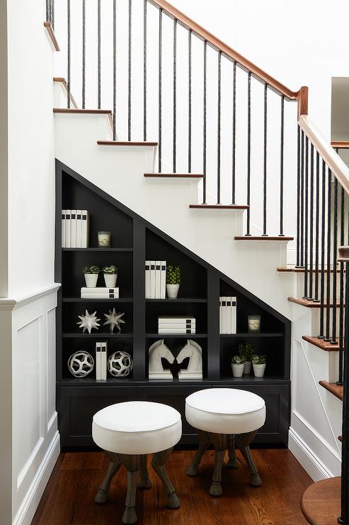 Black-built-in-shelves-under-staircase