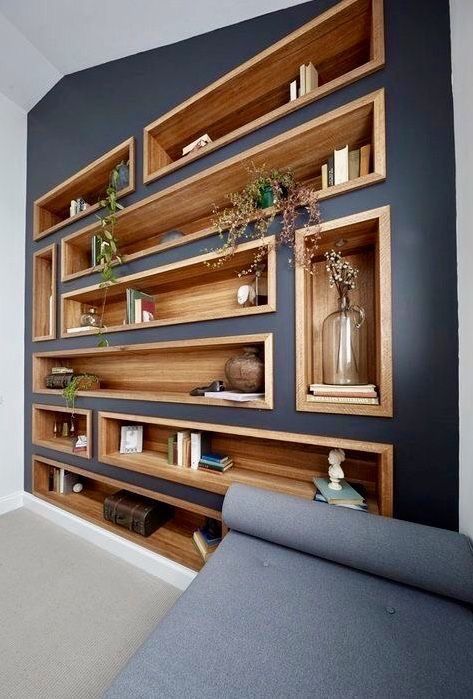 Bookshelves-and-niches-built-into-a-wall-contrast-it-and-make-the-use-of-this-blank-wall-3