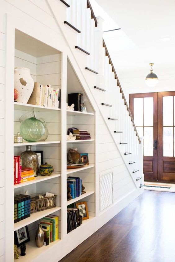 Built-in-open-shelves-under-the-stairs-are-nice-to-get-more-storage-space-without-sacrificing-floor-space