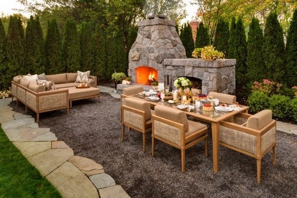 Privacy-fence-screen-ideas-green-fence-thuya-fence-stone-fireplace-outdoor-furniture