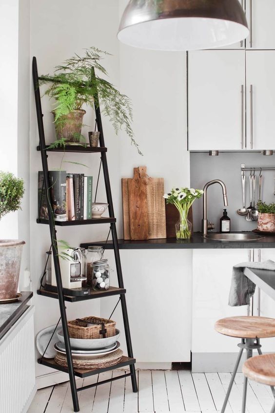 02-a-black-metal-and-wood-industrial-ladder-shelf-for-storage-in-the-kitchen-or-dining-space