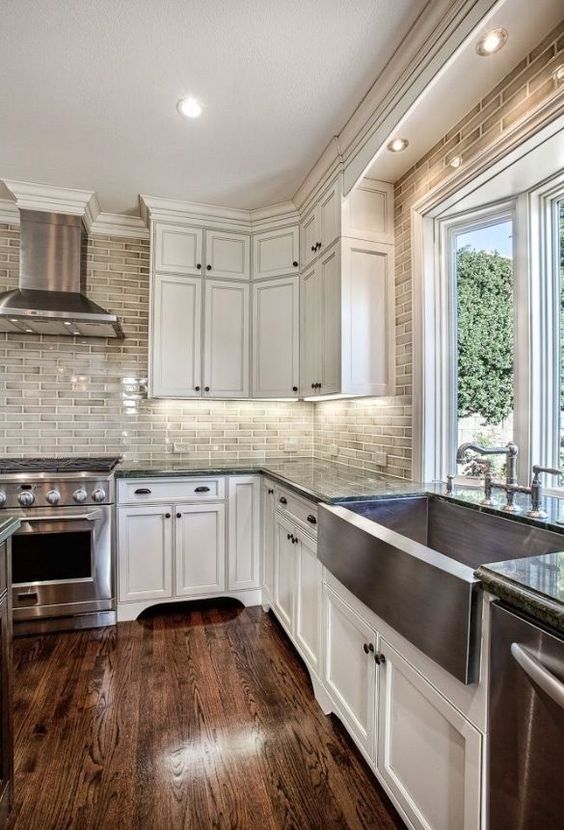 07-rich-colored-hardwood-floors-and-white-wood-cabinets-are-a-chic-and-classic-kitchen-combo
