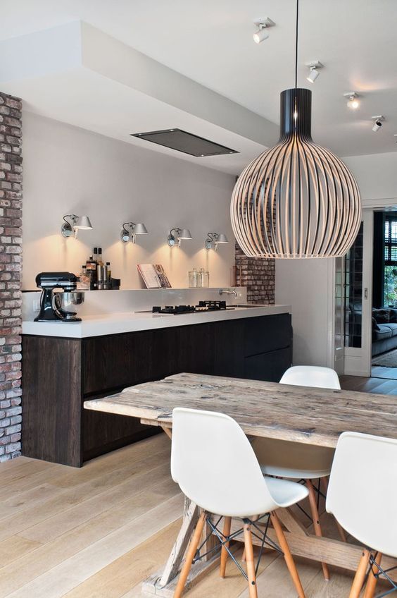 08-a-dark-stained-kitchen-island-is-a-dominant-piece-in-the-whole-space-it-makes-a-statement