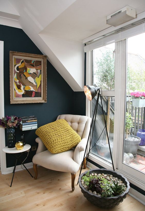 2-04-a-cozy-reading-nook-by-the-window-with-an-artwork-succulents-and-a-small-side-table