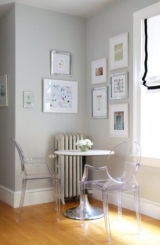 2-16-a-small-breakfast-space-with-a-round-table-and-acrylic-chairs-looks-airy-and-very-comfy