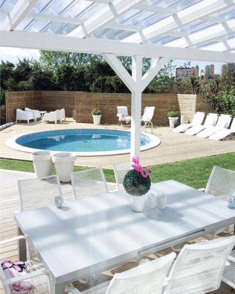 5-a-neutral-contemporary-space-with-loungers-and-white-garden-furniture-and-a-round-pool-clad-in-white-too