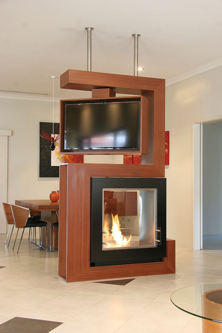 Awesome-room-divider-holds-turnable-tv-and-fireplace