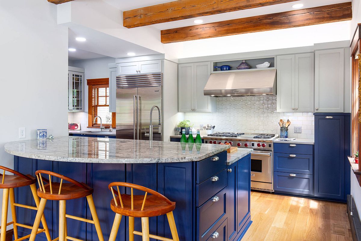 Craftsman-style-kitchen-in-classic-blue-and-white-with-wooden-ceiling-beams