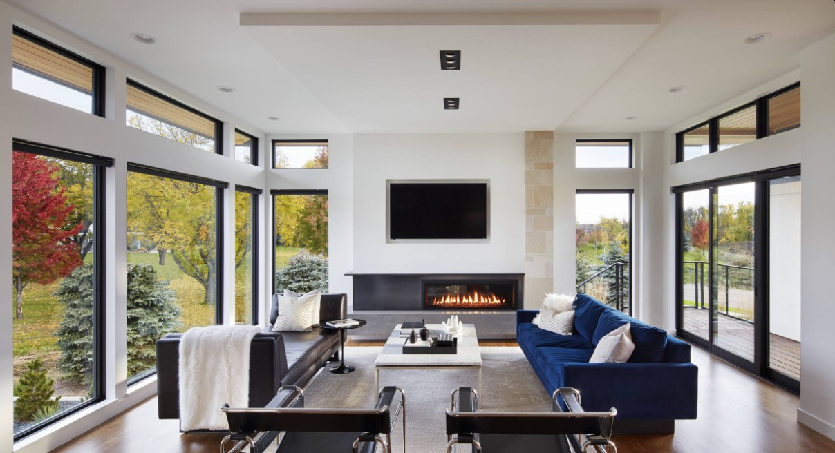 Modern-family-room-with-fireplace-and-lots-of-windows