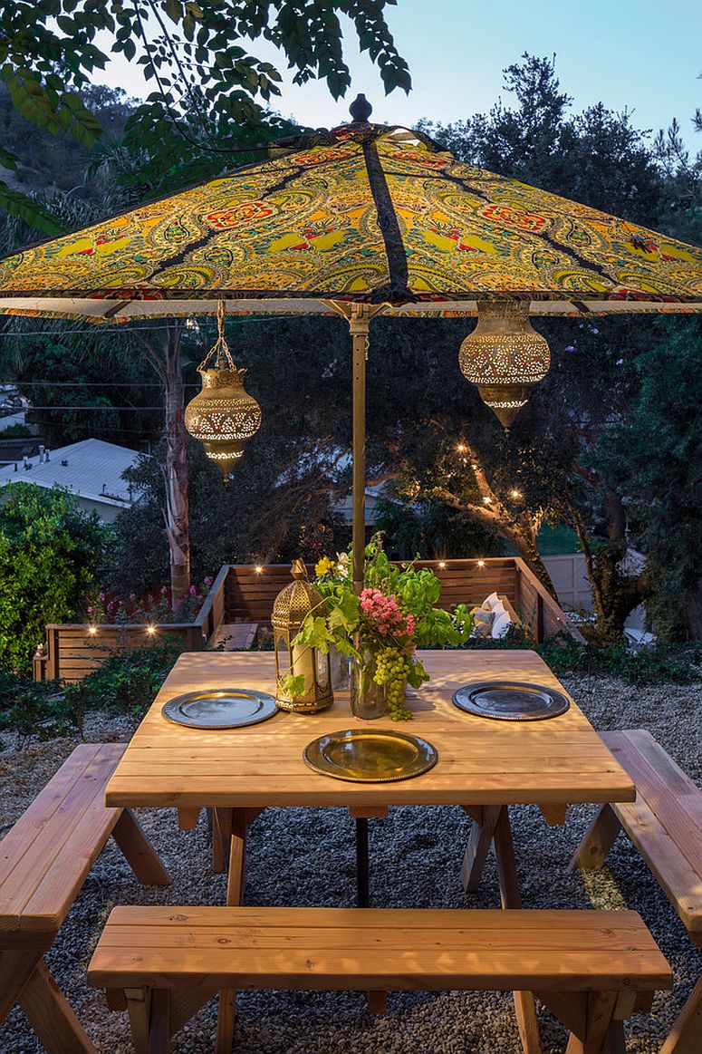 Moroccan-lanterns-and-patterned-umbrella-complete-an-eclectic-outdoor-dining-space