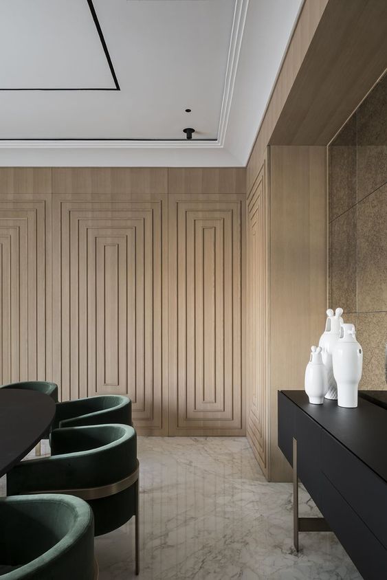 A-plywood-accent-wall-done-with-a-series-of-frames-adds-elegance-and-a-refined-touch-to-the-space