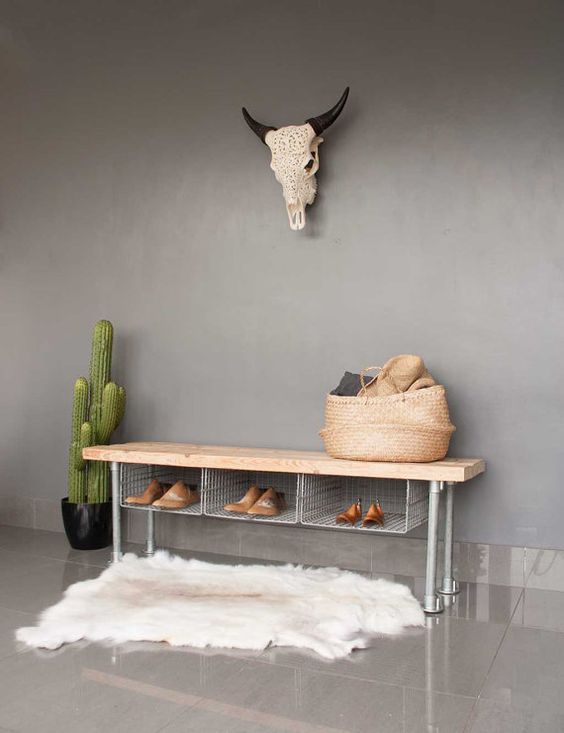 02-a-metal-shoe-rack-bench-with-wire-storage-compartments-and-a-wooden-top-for-an-industrial-space