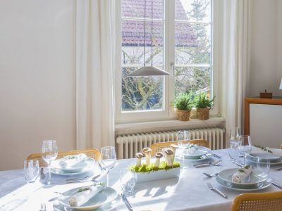 1495675320-dining-room-table-windows-natural-light