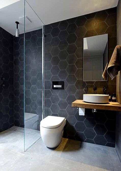 2-03-large-scale-matte-black-hexagon-tiles-with-white-grout-make-the-walls-bold-and-outstanding