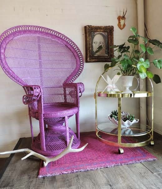 4-19-a-purple-peacock-chair-and-a-matching-rug-is-a-bright-and-non-traditional-idea