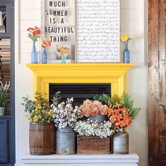 A-couple-of-signs-bright-blooms-in-vases-and-lush-floral-arrangements-in-crates-and-churns-for-summer-decor