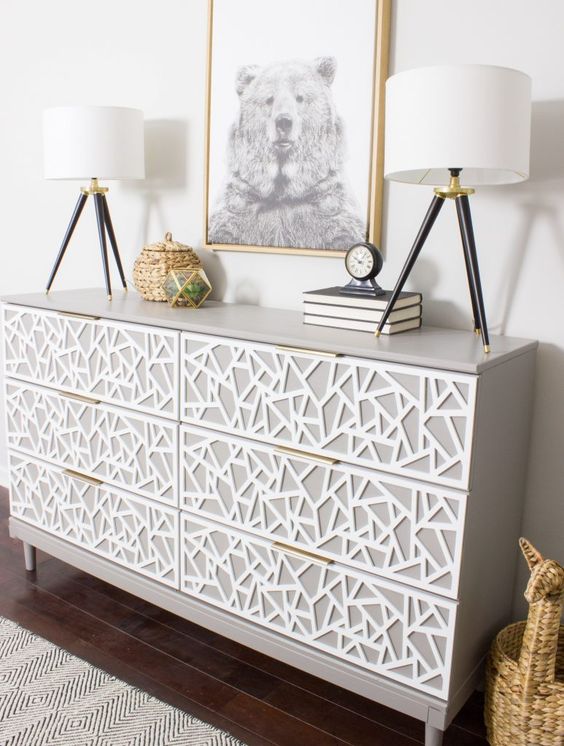 A-creative-tarva-dresser-hack-in-dove-grey-with-white-geometric-inlays-and-tiny-brass-pulls