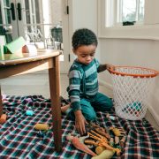 Child_picking-up-his-toys-1296x728-header