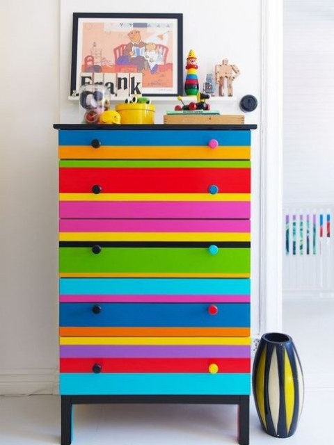 Colorful-striped-tarva-dresser-hack-with-bold-knobs-is-a-fun-and-whimsy-piece-ideal-for-a-kids-room