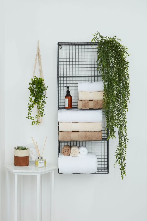 03-a-metal-wall-shelf-for-storing-towels-soaps-greenery-in-pots-is-a-nice-solution-to-save-some-floor-space