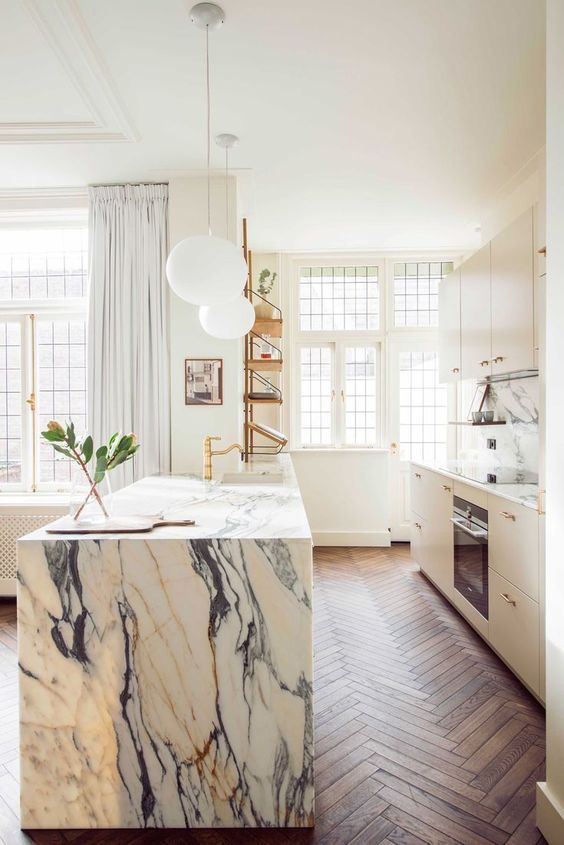 04-a-chic-modern-kitchen-in-white-and-a-white-marble-kitchen-island-gold-fixtures-for-a-more-glam-look