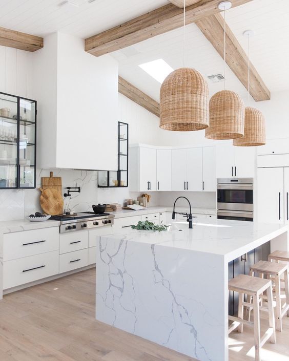 05-a-chic-white-kitchen-with-white-marble-countertops-and-a-backsplash-plus-a-marble-kitchen-island-for-a-refined-feel