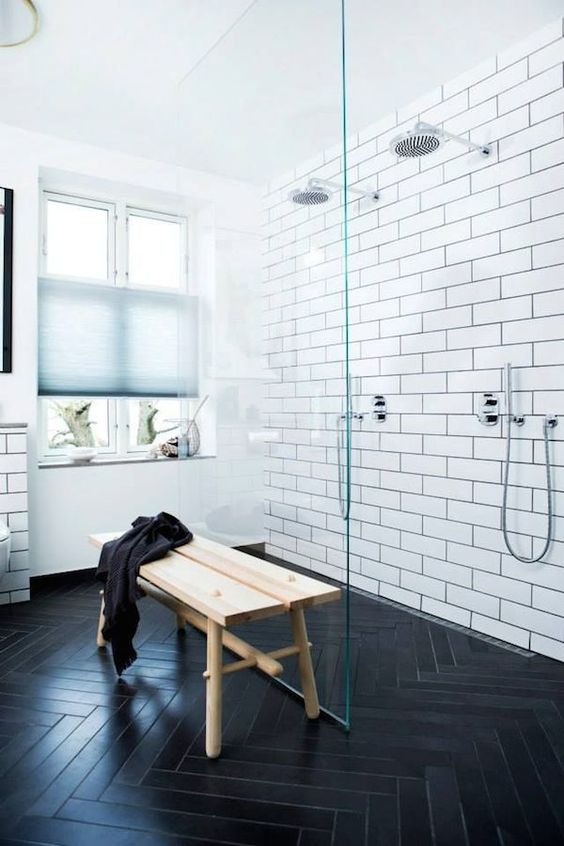 08-subway-tiles-with-black-grout-and-dark-chevron-clad-floors