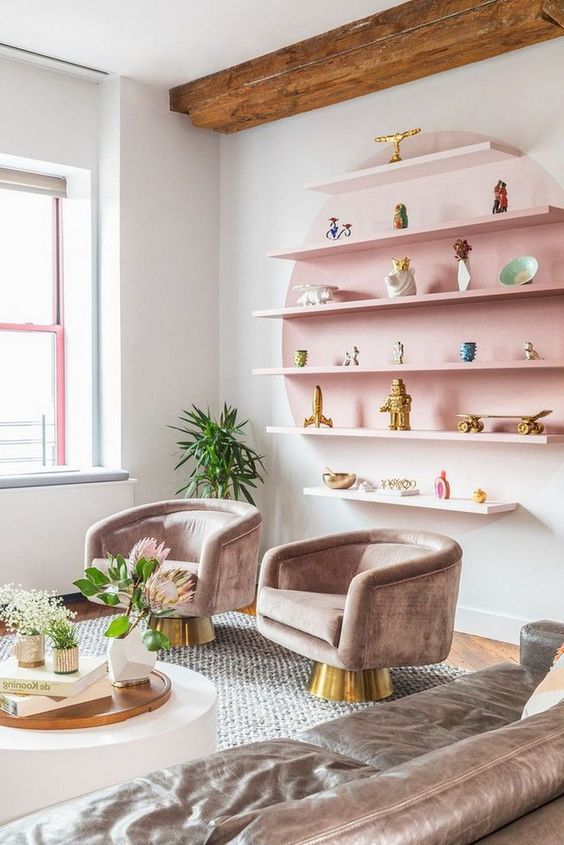 1-10-a-pastel-living-room-with-a-pink-open-shelving-unit-refined-taupe-furniture-and-potted-blooms-and-greenery