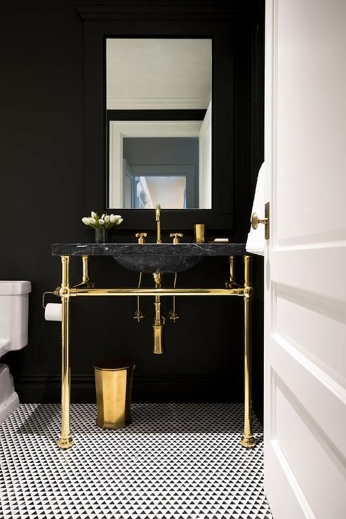 1-15-a-chic-dark-powder-room-accented-with-a-black-marble-sink-on-a-gold-stand-looks-very-exquisite-and-stylish