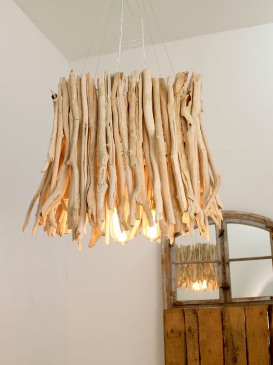1-a-chandelier-made-of-bleached-driftwood-is-a-perfect-option-for-a-beach-or-a-coastal-house