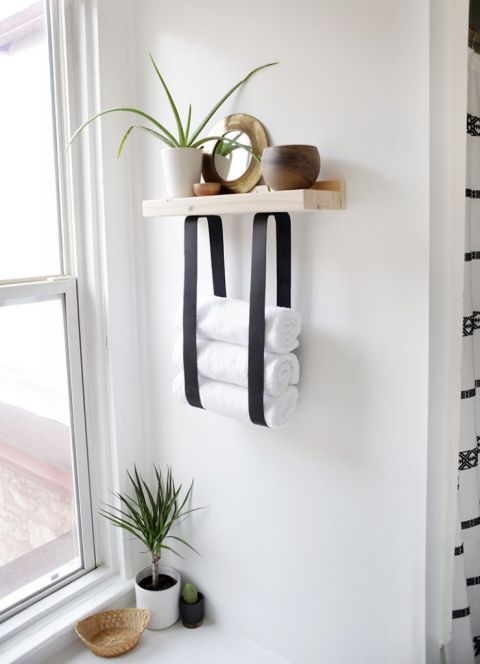 13-a-wood-and-leather-strap-towel-shelf-will-let-you-store-not-only-towels-but-also-decor-and-accessories