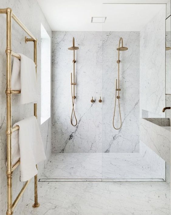 17-an-elegant-white-marble-bathroom-with-brass-and-gold-touches-is-pure-luxury-with-a-modern-feel