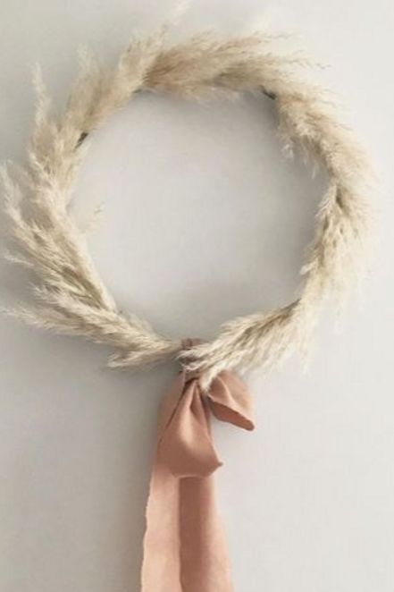 2-a-dried-wheat-wreath-with-a-brown-bow-is-a-cool-fall-decoration-for-any-of-your-spaces