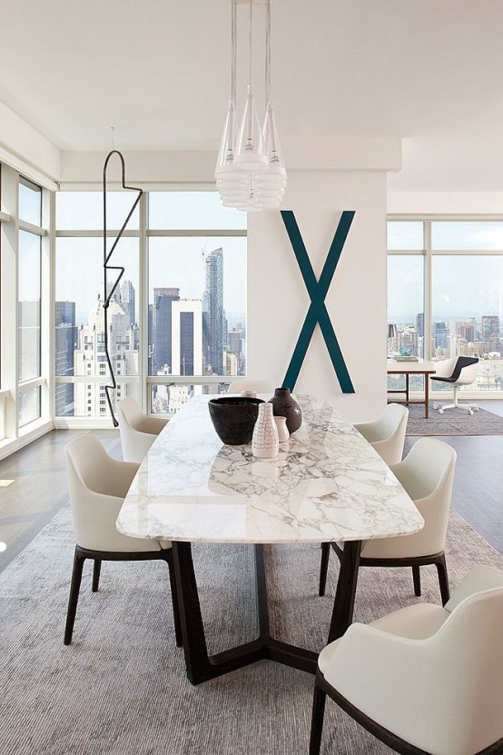 23-a-contemporary-luxurious-dining-table-with-a-black-base-and-a-white-marble-tabletop-for-ultimate-chic