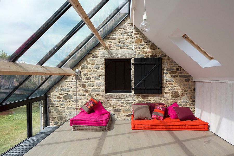 Gorgeous-sunroom-with-informal-seating-along-with-stone-and-glass-walls