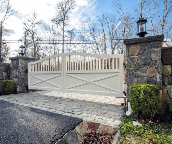 Double-gates-painted-white-for-driveway-entrance-of-home