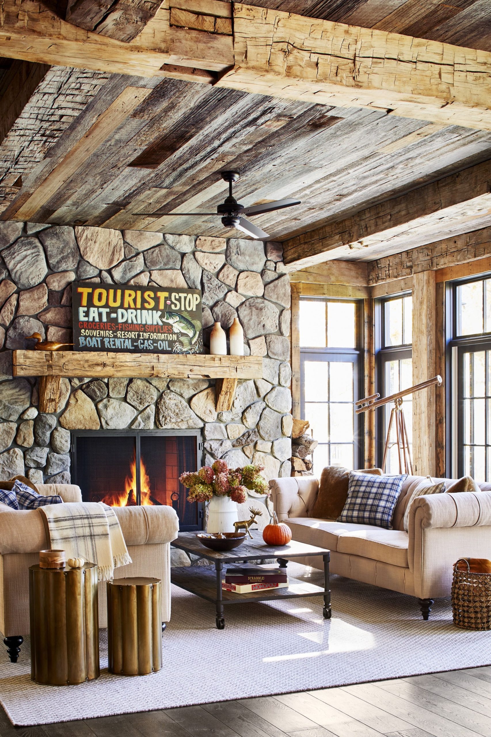 Rustic-living-room-stone-fireplace-wood-beams-1569464905