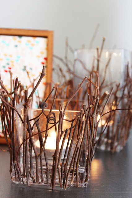 Square-glass-candleholders-covered-with-twigs-and-sticks-are-cool-decorations-that-bring-coziness-to-the-space