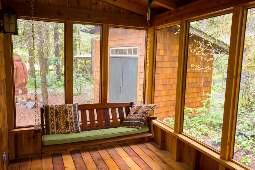 Wood-sunroom-with-bench-swing