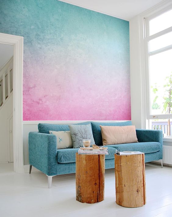 02-a-bright-turquoise-to-pink-gradient-wall-is-a-gorgeous-statement-in-the-space-it-brings-much-color
