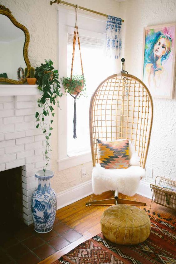 02-a-cozy-wicker-chair-on-a-stand-is-a-must-for-a-boho-or-eclectic-interior