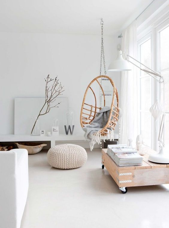 04-a-rattan-hanging-chair-on-a-chain-makes-the-interior-warmer