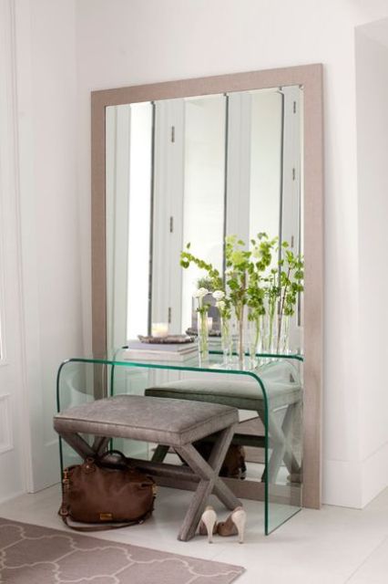 05-a-mirror-in-a-light-colored-wooden-frame-for-a-modern-entryway