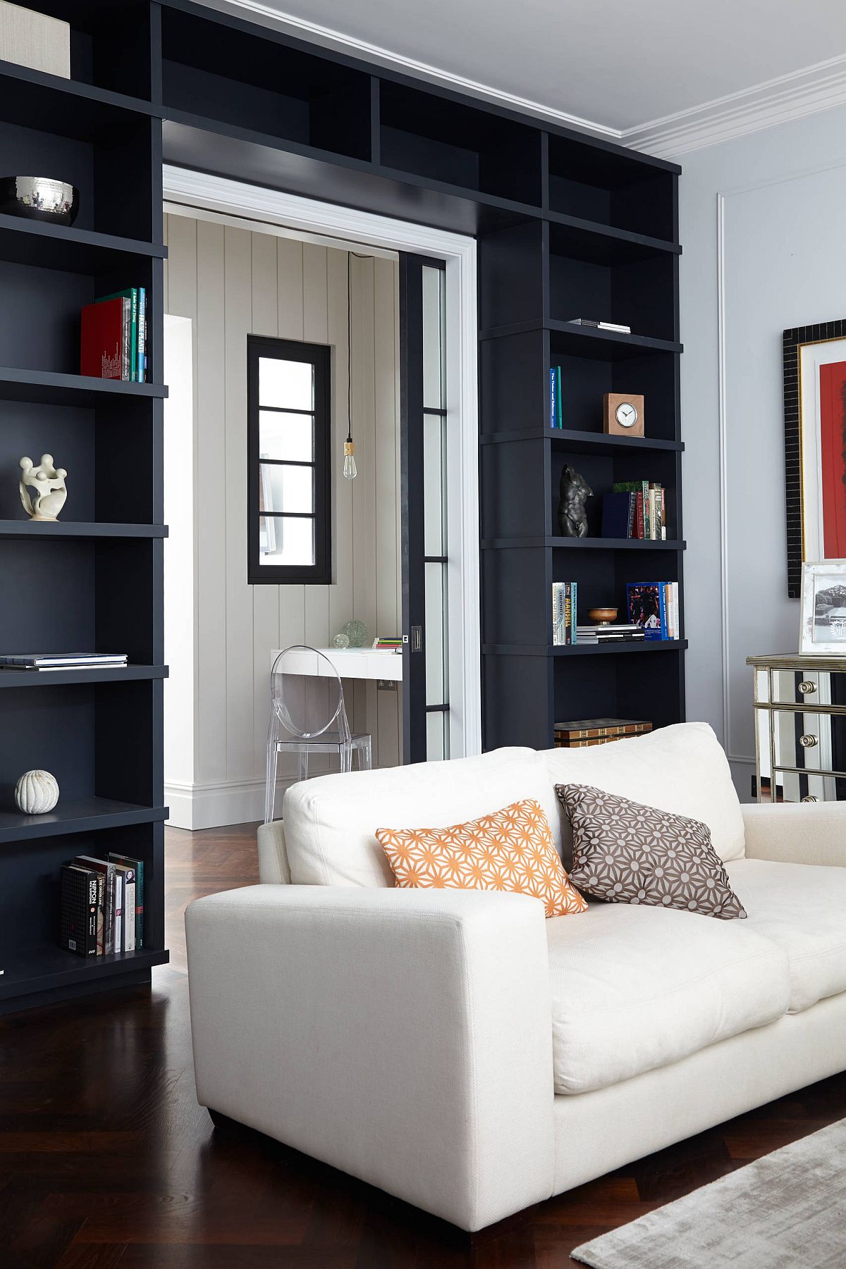 1-dark-and-dashing-doorway-created-using-black-open-shelves-wrapped-around-it
